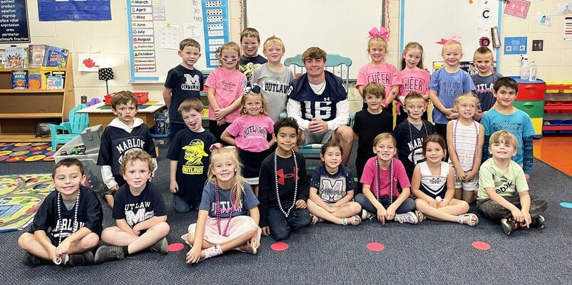 Outlaw Football Buddy, Braden Bowman visits with little Outlaws in Jenna Derryberry’s kindergarten class at Marlow Elementary. Photo submitted by Heather Gage (