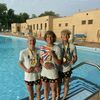 Mayson Thiebauld, Karsten Terrell, and Gage DaVoult show off medals and awards won at the AAU Junior Olympics in Houston.