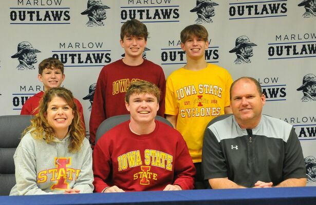 Marlow senior Jace Gilbert (center) was joined by friends, family, and faculty on Wednesday as he signed his Letter of Intent to play football at Iowa State after graduation.

Photo by Elizabeth Pitts-Hibbard/The Marlow Review