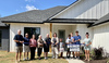 Marlow Chamber of Commerce members officially welcome James and Shawna Mitchell, owners of New Day Homes, with a ribbon cutting on Sunday, Aug. 27, 2023. From left, Lynn Bailey, Jason McPherson, Sonya Cummings, Realtor Spanky Davis, James Mitchell, Shawn Mitchell, Chrisnie Mitchell, Dez Mitchell, Ethan Mitchell, Cooper Hornbuckle. Not pictured: Jack Mitchell.