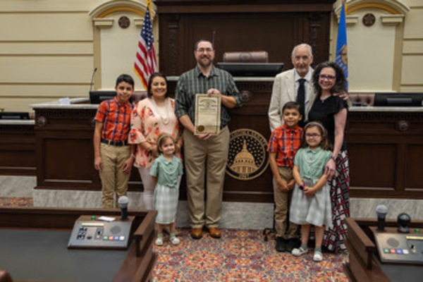 John Patrick, of Sand Springs, and his family visited the state Capitol before donating a copy of 1913 legislation that appropriated funding for the building.