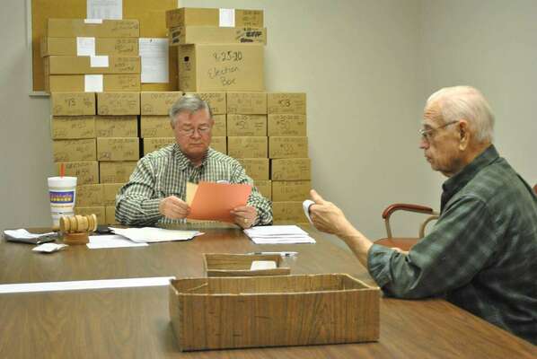 Local party leaders, Leon Farris, with the GOP Stephens County, left, and Jim Holland, right, for the Democrat party, certify incoming tickets for Nov. 8, 2022, General Election for Stephens County, at the Stephens County Election Board office. Photo by Toni Hopper/The Marlow Review