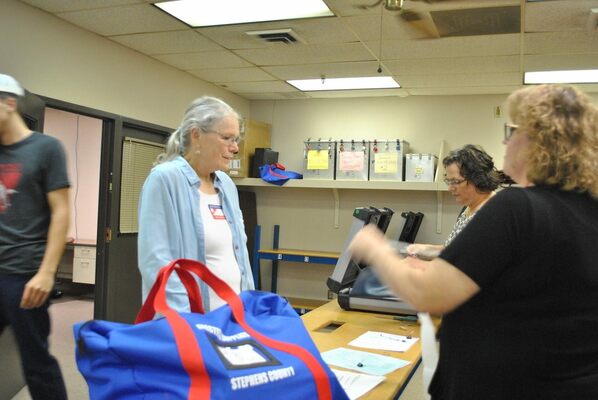 Mary Cobb turns the ballot boxes and accompanying materials to Shawnda Seeley at the Stephens County Election Board Tuesday, Nov. 8, 2022. Cobb reported upon check-in that she had 675 ballots cast at Marlow's Precinct 33, Garfield Smith Public Library, for the General Election. It was one of the largest turnouts for precincts in the county. Photo by Toni Hopper/The Marlow Review