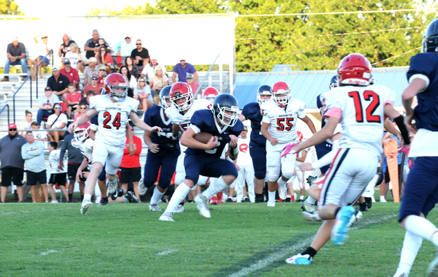 Marlow Outlaw #2 Dayton Alaniz holds onto the football in his attempt to gain yardage against the Lindsay Warriors in the 8th grade game, Thursday, Sept. 28, 2023 at Outlaw Stadium. Photo by Toni Hopper/The Marlow Review