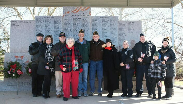Veterans and Daughters of the American Revolution Duncan Indian Territory Chapter (NSDAR) members braved cold weather to participate in the annual Wreaths Across America national event, with a local ceremony at the Marlow Cemetery. In attendance were, from left, Robert and Susan Denard, Jack and Pamela Greenwood, Bobby Cobb, Randy Oldham, Mary Kay Lentz, Marlow Police Officers, Gina Phillips and Ronnie Smith, and Lynette McReynolds and her son, Jake. Photo by Toni Hopper/The Marlow Review