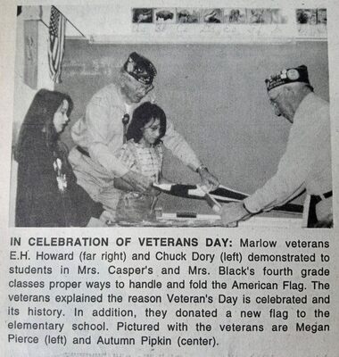 This week's snapshot from The Marlow Review archives is from Nov. 20, 1997. It features veterans E.H. Howard and Chuck Dory, showing elementary students, Megan Pierce and Autumn Pipkin, the proper way to handle and fold the American Flag.