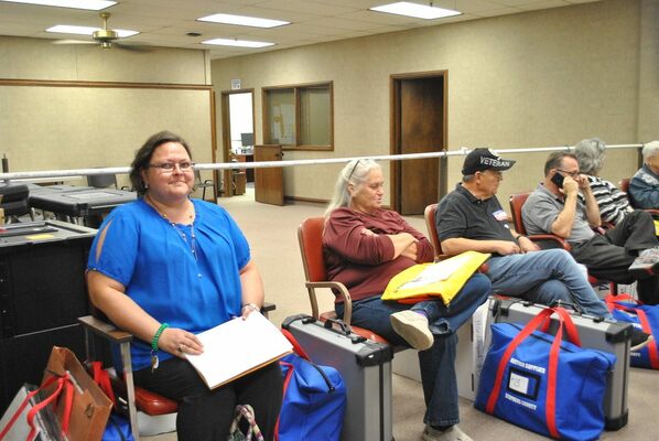 Lacy Burch, left, waits her turn for check-in with ballots from Marlow Precinct #31 (Eastside Baptist Church), along with other precinct captains, at the Stephens County Election Board in Duncan, Tuesday, Nov. 8, 2022. Photo by Toni Hopper/The Marlow Review