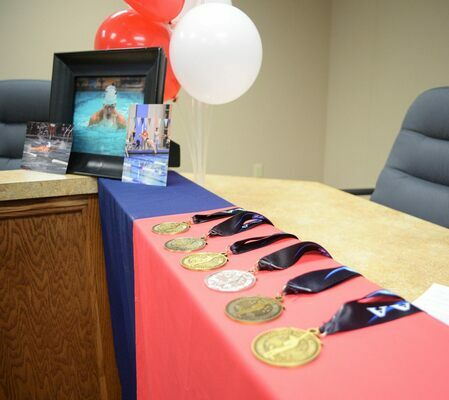 Just a few of the many medals Gage DaVoult has earned during his high school competitive swimming career. Photo by Toni Hopper/The Marlow Review
