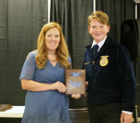 Comanche ag teacher, Shelbi Morgan, presents Jack Glover with his Greenhand degree at the Waurika PI FFA contest Oct. 4, held at the Stephens County Fair &amp; Expo Center in Duncan. SUBMITTED PHOTO