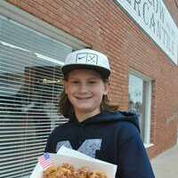 Gatlin Greer, 14, of Marlow, son of Amy Greer, was ready to devour some miniature bacon covered donuts during the Second on Second fall festival. All he needed was some hot cocoa.