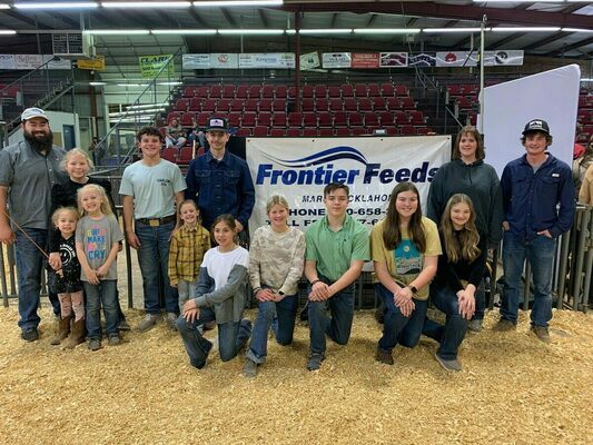 Marlow FFA and 4-H members smile proudly after a record-year for the annual Marlow Winter Classic hosted for numerous chapters throughout Oklahoma. Marlow Ag Booster President, Kenny Baker, said it was one of the biggest and best shows in years. Photo Submitted by Kenny Baker