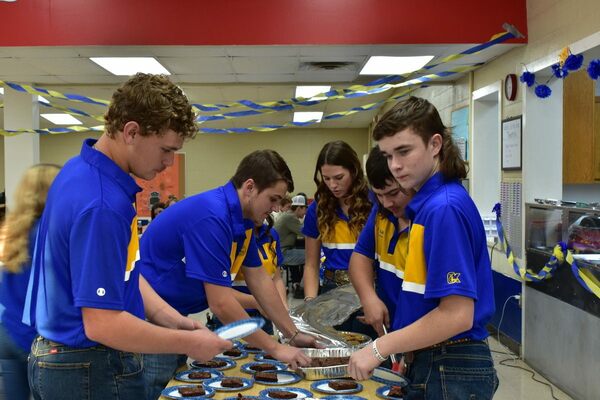 Bray-Doyle FFA members Brody Whitney, Ethan Fisher, Jaiden Poston, Aaron Kelly and Jackson Anderson, stay busy during their annual FFA Labor Auction, Nov. 4. Photo by Jordan Ince