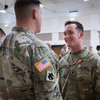 Spc. Alexander Weimer, assigned to Bravo Company, 545th Brigade Engineer Battalion, 45th Infantry Brigade Combat Team, Oklahoma Army National Guard, speaks with Col. Andrew Ballenger, commander of the 45th IBCT at his Oklahoma Star of Valor Ceremony at the Muskogee Armed Forces Reserve Center, Muskogee, Oklahoma, March 3, 2024. (Oklahoma Army National Guard by Cpl. Danielle Rayon)