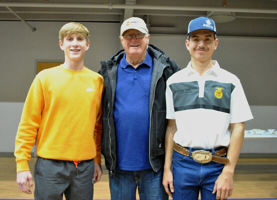 Phil Fleetwood, center, was one of many financial supporters at the Marlow FFA Labor Auction and meal. His grandson, Major, left and Korben Baker, right, will each provide eight hours of labor. Fleetwood owns Fleetwood Farms of Marlow. Photo by Toni Hopper/The Marlow Review