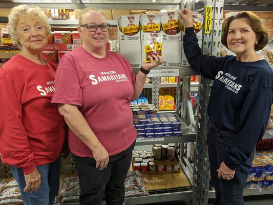 GETTING READY for the annual Marlow Samaritan Christmas food boxes are volunteers (l-r) Sue Cramton, Paula Belcher and Hilma Shepherd. Sign up begins Monday, Nov. 27. Photo submitted by Cricket Holland