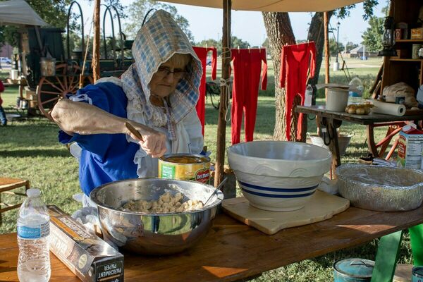 Carlann Miller prepares a deep-dish peach cobbler during Western Spirit Celebration Day at the Chisholm Trail Heritage Center last fall (2022). She and husband, Jack take their chuckwagon to numerous events. Photo by Dee Dodson/The Marlow Review