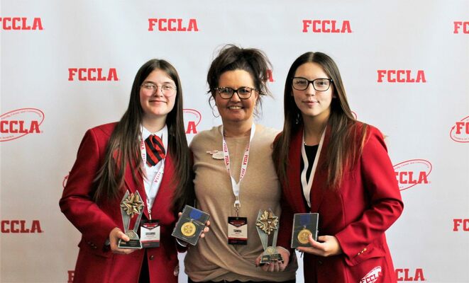 Brianna Dalrymple, FCCLA Adviser Tamra May, and Kyleigh Baker show off the awards earned by the Marlow High School team at the FCCLA State Leadership Convention, April 6, 2023.