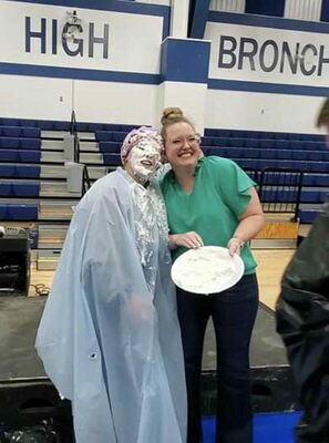 Bonnie Gatewood had the honors of smashing a plain whipped cream pie into Central High FFA officer, Carson Baker's face at the FFA labor auction and dinner, Thursday, Nov. 3, 2022. Gatewood is a mentor, family friend and one of Baker’s cheer coaches. Photos Submitted by Carson Baker.