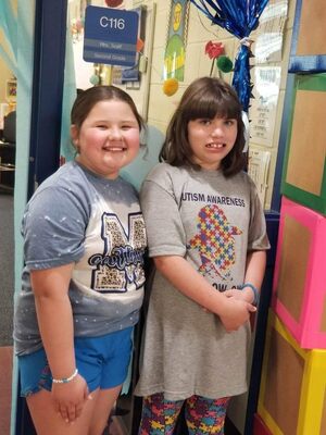 Gentry Derryberry and Tiffany Red Elk share a moment of solidarity for Autism Awareness, on April 3, at Marlow Elementary School. Photo Submitted by Kim Kizarr